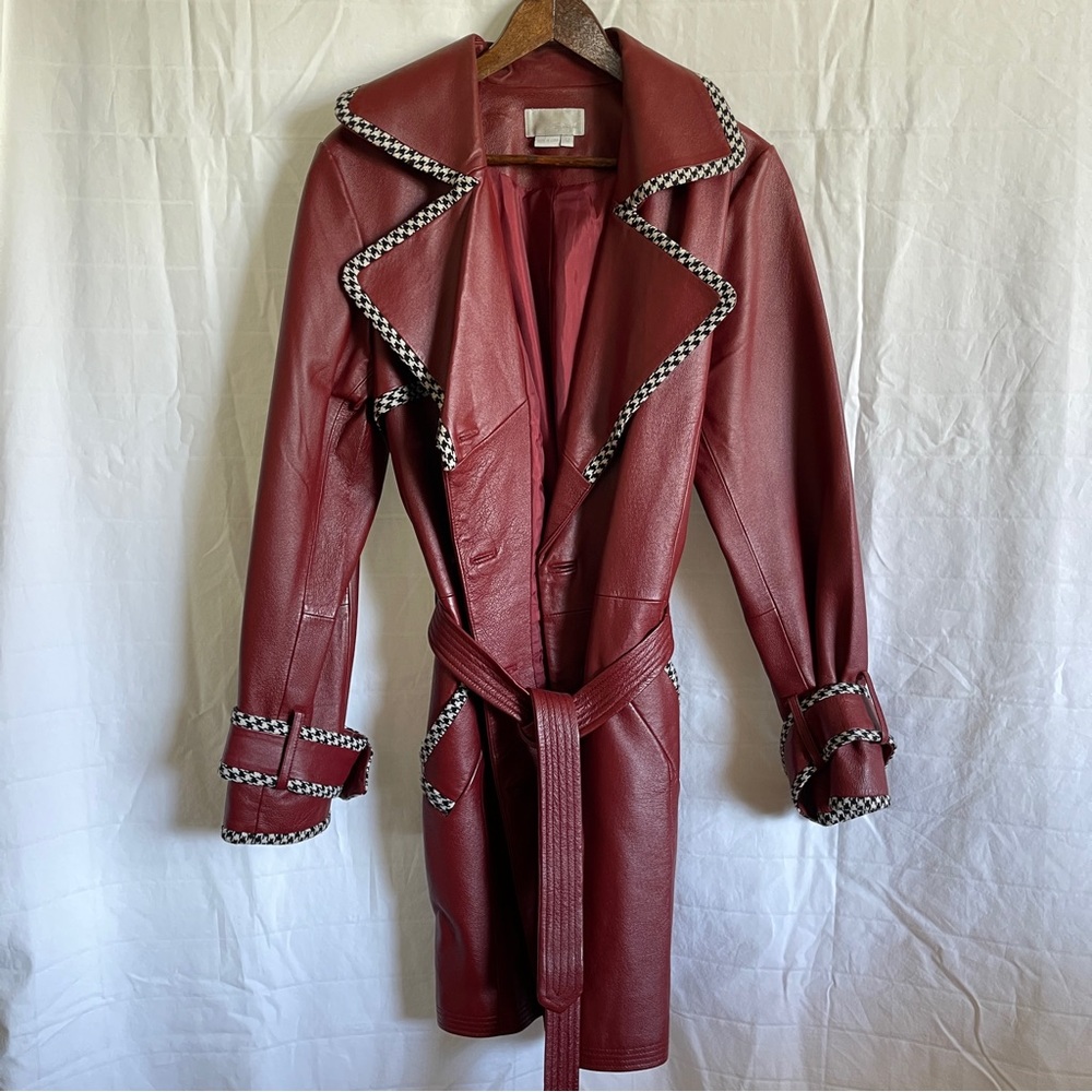 Red leather trench coat with black and white chevron lining